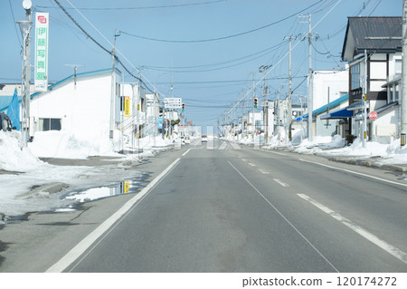The road leading to the port of Yubetsu Town, where the snow has begun to melt as winter turns to spring. The road leading to the port of Yubetsu Town, where the snow has begun to melt as winter turns to spring. 120174272