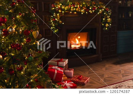Classical Christmas decorated interior living room with fireplace. Christmas tree with red golden ornament decorations gift boxes. Modern classic style interior design apartment. Christmas eve at home Classical Christmas decorated interior living room with fireplace. Christmas tree with red golden ornament decorations gift boxes. Modern classic style interior design apartment. Christmas eve at home 120174287
