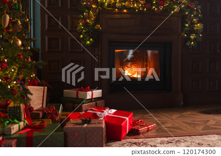 Classical Christmas decorated interior living room with fireplace. Christmas tree with red golden ornament decorations gift boxes. Modern classic style interior design apartment. Christmas eve at home Classical Christmas decorated interior living room with fireplace. Christmas tree with red golden ornament decorations gift boxes. Modern classic style interior design apartment. Christmas eve at home 120174300