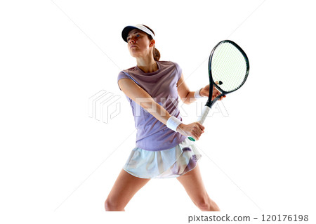 Portrait of focused on game tennis player, prepares to meet ball, body aligned with her goal against white studio background. 120176198