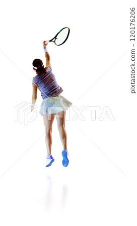 Back view photo of player in sportswear jumps high, racket raised high for overhead swing against white studio background. 120176206