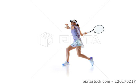 Ready and focused, athletic tennis player, exudes confidence and readiness during game against white studio background. 120176217
