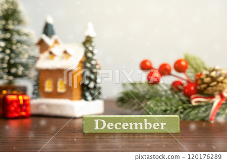 December block against the background of a Christmas tree and a house with snow. Concept of the beginning of a new winter season 120176289