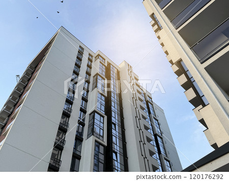 View of multi-storey buildings in a modern residential complex on a sunny day a blue sky background. Skyscrapers and real estate View of multi-storey buildings in a modern residential complex on a sunny day a blue sky background. Skyscrapers and real estate 120176292