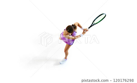 Focused, female tennis player in top-down shot, her eyes fixed on ball against white studio background. 120176298
