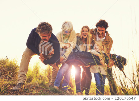 Family is a gift that lasts forever. Shot of a multi-generational family having fun on a hill top. Family is a gift that lasts forever. Shot of a multi-generational family having fun on a hill top. 120176547