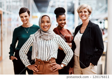 My place is here as part of the team. Portrait of a young businesswoman standing in an office with her colleagues in the background. 120176811