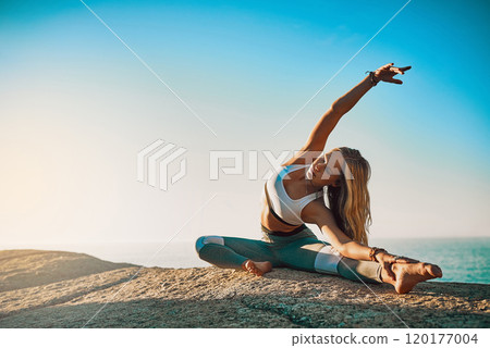I am in the process of positive changes. Shot of an athletic young woman practicing yoga on the beach. I am in the process of positive changes. Shot of an athletic young woman practicing yoga on the beach. 120177004