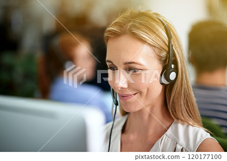 Directing calls with a smile. Cropped shot of a young businesswoman wearing a headset. 120177100