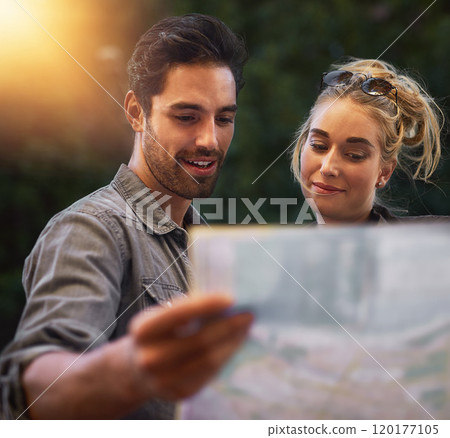 We have so many options. Shot of a young couple using a map while exploring the city. 120177105