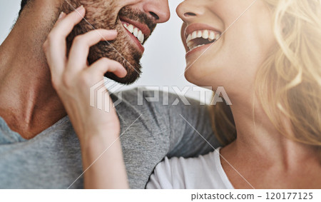 The simple joy of a tender loving touch. Shot of a young couple enjoying a relaxing and romantic moment at home. 120177125