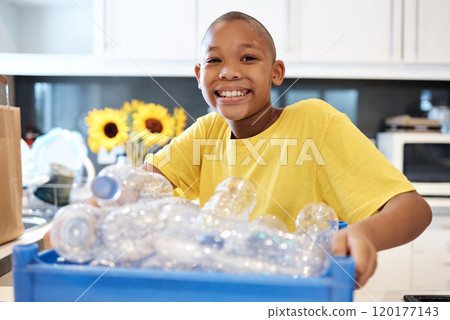 Securing the earths future by recycling. Shot of a young boy getting ready to recycle some bottles at home. Securing the earths future by recycling. Shot of a young boy getting ready to recycle some bottles at home. 120177143