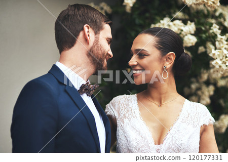 Love brought us together. Shot of a happy newlywed young couple posing together on their wedding day. 120177331
