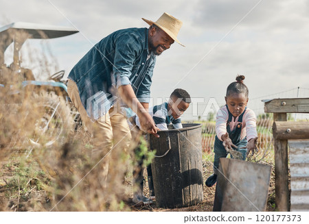 The best lessons are lived, not handed down. Shot of a mature man working his adorable son and daughter on a farm. 120177373