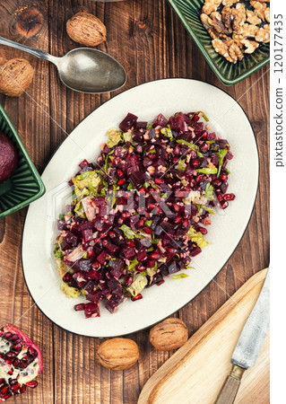 Beetroot pomegranate salad, rustic style. 120177435