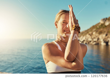 Yoga is beneficial for everyone. Shot of a young woman doing yoga at the beach. 120177636