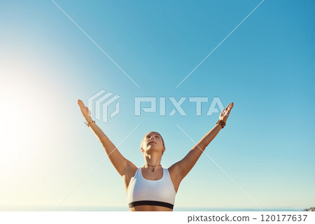 I feel free whenever I do yoga. Shot of an athletic young woman practicing yoga on the beach. 120177637