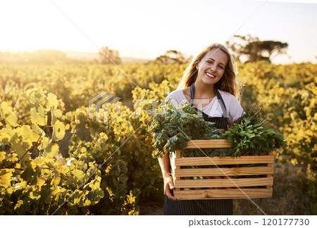 Stock your pantry with fresh produce. Shot of a young woman holding a crate full of freshly picked produce on a farm. Stock your pantry with fresh produce. Shot of a young woman holding a crate full of freshly picked produce on a farm. 120177730