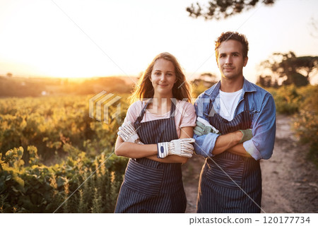 Were very strict on keeping our produce organic. Portrait of a confident young man and woman working together on a farm. 120177734
