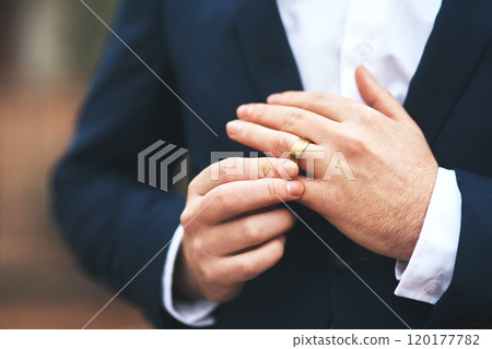 Hes ready to tie the knot. Cropped shot of an unrecognizable bridegroom adjusting his ring on his wedding day. Hes ready to tie the knot. Cropped shot of an unrecognizable bridegroom adjusting his ring on his wedding day. 120177782