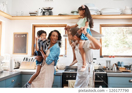 Having a god time in the kitchen. Shot of a young family spending quality time together in the kitchen at home. 120177790