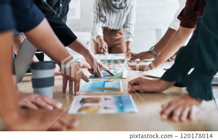 Go getters get hands on. Cropped shot of a group of businesspeople discussing paperwork during a meeting in a modern office. 120178014