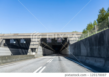 High-speed road tunnel view from a fast-moving car. High-speed road tunnel view from a fast-moving car. 120178087