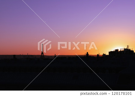 View of Paris and Eiffel Tower and rooftops from above. Beautiful sunset over Paris, France View of Paris and Eiffel Tower and rooftops from above. Beautiful sunset over Paris, France 120178101