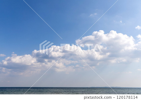 Beautiful white clouds on blue sky over sea Beautiful white clouds on blue sky over sea 120178114