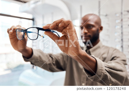 Zoom in on the things that matter. Shot of a young woman buying a new pair of glasses at an optometrist store. Zoom in on the things that matter. Shot of a young woman buying a new pair of glasses at an optometrist store. 120178248
