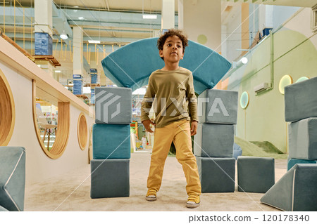 Cute boy playing with soft cubes 120178340