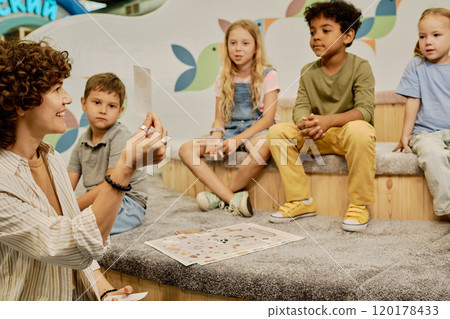 Teacher communicating to little kids Teacher communicating to little kids 120178433