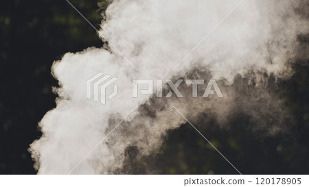 Dense white smoke rising against a dark backdrop, ideal for conveying concepts of fire, pollution, or intrigue Dense white smoke rising against a dark backdrop, ideal for conveying concepts of fire, pollution, or intrigue 120178905