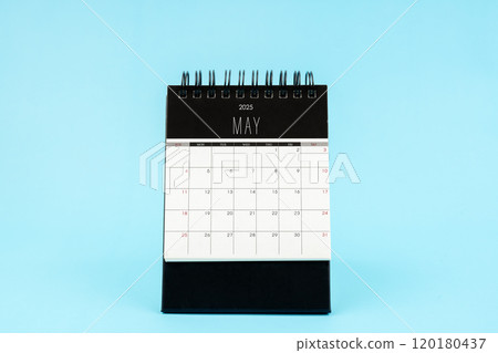 May 2025 Monthly desk calendar for 2025 year on blue background. May 2025 Monthly desk calendar for 2025 year on blue background. 120180437