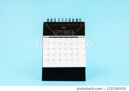 September 2025 Monthly desk calendar for 2025 year on blue background. September 2025 Monthly desk calendar for 2025 year on blue background. 120180438