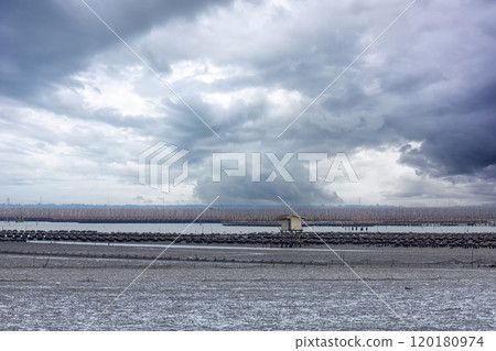 Home on the Sea. Alone Houses on muddy shore around 120180974
