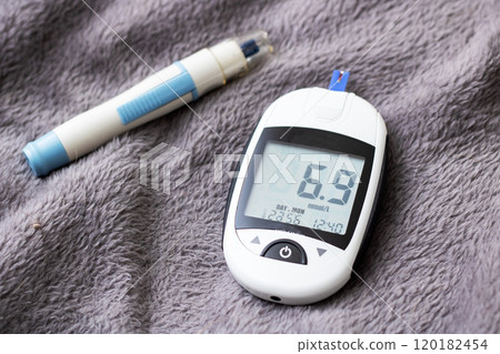 Blood Glucose Monitor and Insulin Pen Safely Placed on a Soft Surface for Daily Use 120182454