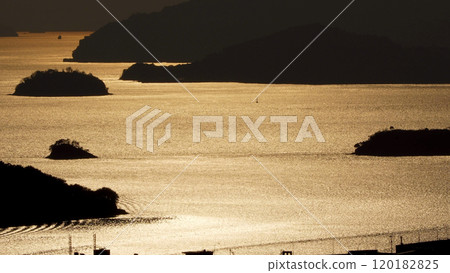 The golden glow of the Seto Inland Sea at dusk from Senkojiyama Park 120182825