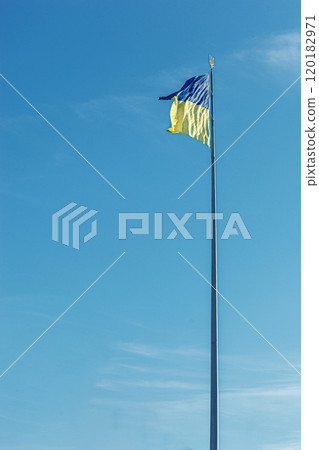 Ukrainian flag against the blue sky 120182971