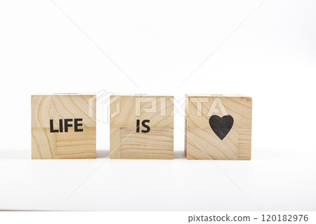 Wooden cubes with the inscription life is love on a white background 120182976
