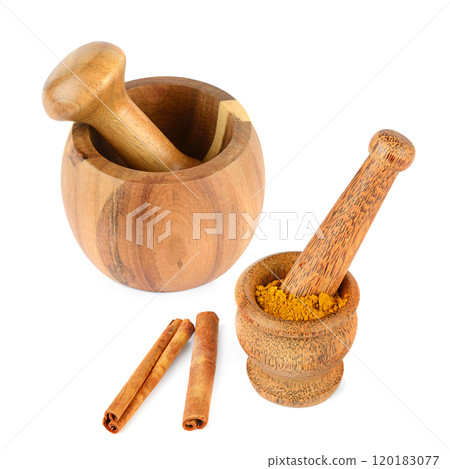 Wooden mortar, pestle, cinnamon sticks and powder isolated on white background. Wooden mortar, pestle, cinnamon sticks and powder isolated on white background. 120183077