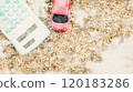 Painting of model car and calculator are on the exposed aggregate concrete background. Planning of saving for buying car, car loan and car insurance concept. 120183286