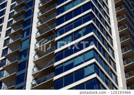Modern High-Rise Building with Glass Balconies 120183466