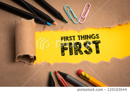 First things first. Torn cardboard and office supplies First things first. Torn cardboard and office supplies 120183644