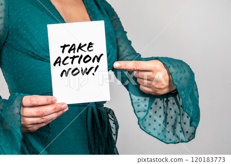 Take Action Now. Woman points a finger at the text 120183773