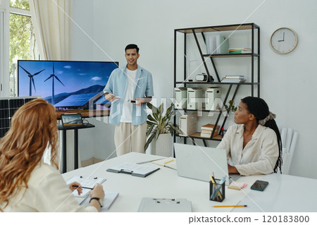 Man Presenting New Technology For Colleagues Man Presenting New Technology For Colleagues 120183800