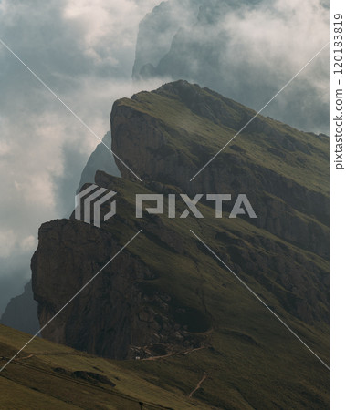 The Majestic Peaks of Seceda in the enchanting Dolomites are Shrouded in Mysterious Mist and Beauty 120183819