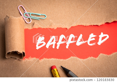 Baffled. Torn cardboard and pencils on a red background 120183830