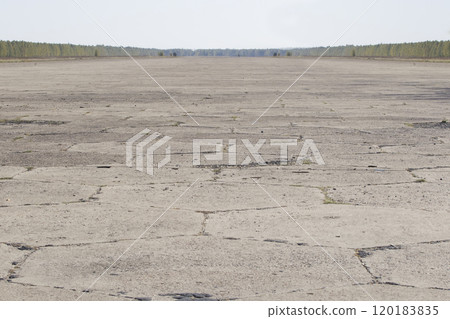 Old runway. Strip of old asphalt Old runway. Strip of old asphalt 120183835