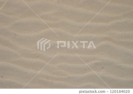 View from above, diagonal wave direction. Wind marks on the beach sand. View from above, diagonal wave direction. Wind marks on the beach sand. 120184020